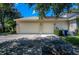 Two-car garage with light fixtures and driveway at 3706 162Nd E Ave, Parrish, FL 34219