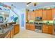 Kitchen boasts wood cabinets, granite countertops, and stainless steel appliances at 3706 162Nd E Ave, Parrish, FL 34219