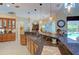 Kitchen features an island, granite countertops, and stainless steel appliances at 3706 162Nd E Ave, Parrish, FL 34219