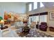 Spacious living room with high ceilings, hardwood floors, and a view of the kitchen at 3706 162Nd E Ave, Parrish, FL 34219