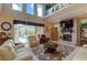Relaxing living room with high ceilings, fireplace, and natural light at 3706 162Nd E Ave, Parrish, FL 34219