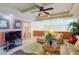Bright living room featuring a TV and comfortable seating at 3706 162Nd E Ave, Parrish, FL 34219