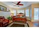 Primary bedroom with king bed, pool access, and ceiling fan at 3706 162Nd E Ave, Parrish, FL 34219
