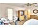 Bedroom with double bed, dresser, and home office space at 380 Three Lakes Ln # L, Venice, FL 34285