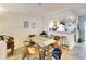 Condo dining area with table and chairs, open to the kitchen at 380 Three Lakes Ln # L, Venice, FL 34285