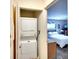 Stackable washer and dryer in a small laundry closet at 380 Three Lakes Ln # L, Venice, FL 34285