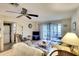 Bright condo living room with comfortable seating and access to balcony at 380 Three Lakes Ln # L, Venice, FL 34285