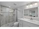 Updated bathroom with a walk-in shower and white vanity at 414 Cerromar S Cir # 249, Venice, FL 34293