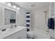 Clean bathroom with tub, shower, vanity with sink, and nautical theme at 414 Cerromar S Cir # 249, Venice, FL 34293