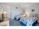 Guest bedroom with twin beds, dresser, and access to a bathroom at 414 Cerromar S Cir # 249, Venice, FL 34293