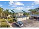 Condo building exterior with parking and landscaping at 414 Cerromar S Cir # 249, Venice, FL 34293
