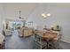 Round dining table with four chairs, view of living room at 414 Cerromar S Cir # 249, Venice, FL 34293