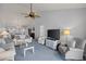 Light-filled living room with comfortable seating and views into dining and kitchen area at 414 Cerromar S Cir # 249, Venice, FL 34293