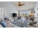 Spacious living room featuring ample seating, a large TV, and view to a bedroom at 414 Cerromar S Cir # 249, Venice, FL 34293