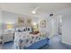 Main bedroom with king-size bed and en-suite bathroom access at 414 Cerromar S Cir # 249, Venice, FL 34293