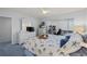 Main bedroom with king bed, dresser, and view of the balcony at 414 Cerromar S Cir # 249, Venice, FL 34293