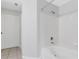 Bathroom with white tub, shower, and tile flooring at 4178 Central Sarasota Pkwy # 316, Sarasota, FL 34238