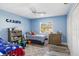 bedroom with twin beds, built-in shelving, and cheerful decor at 4498 Diamond E Cir, Sarasota, FL 34233