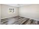 Bright bedroom with wood-look floors and a ceiling fan at 4498 Diamond E Cir, Sarasota, FL 34233