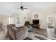 Living room with sectional sofa, hardwood floors and views to the backyard at 4498 Diamond E Cir, Sarasota, FL 34233