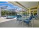 Relaxing patio area with pool, spa, and outdoor furniture at 4673 Deer Creek Blvd, Sarasota, FL 34238