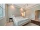 Spacious bedroom with king-size bed and en-suite bathroom access at 5272 Highbury Cir, Sarasota, FL 34238