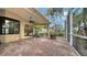 Spacious screened patio with brick pavers and a fire pit at 5272 Highbury Cir, Sarasota, FL 34238