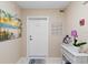 Nicely decorated condo entryway with beach-themed art at 5300 Ocean Blvd # 704, Sarasota, FL 34242