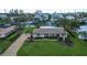 Bird's-eye view of single-story home with waterfront access at 5981 Emerald Harbor Dr, Longboat Key, FL 34228