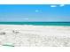 Relaxing beach view with white sand and clear water at 5981 Emerald Harbor Dr, Longboat Key, FL 34228