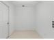 Empty room with tile flooring and a door at 6015 Florida St St, Punta Gorda, FL 33950