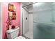 Clean bathroom with a walk-in shower and pink walls at 636 Estuary Dr # 636, Bradenton, FL 34209