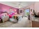 Spacious bedroom with a queen-size bed and access to a balcony at 636 Estuary Dr # 636, Bradenton, FL 34209