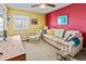 Secondary bedroom with sofa and striped couch at 636 Estuary Dr # 636, Bradenton, FL 34209