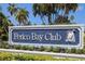 Perico Bay Club entrance sign with tropical landscaping at 636 Estuary Dr # 636, Bradenton, FL 34209