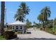 Gated entrance to community with guardhouse and palm trees at 636 Estuary Dr # 636, Bradenton, FL 34209