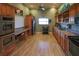 Community kitchen with stainless steel appliances and wood cabinets at 636 Estuary Dr # 636, Bradenton, FL 34209
