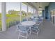 Screened-in community patio with tables and chairs at 636 Estuary Dr # 636, Bradenton, FL 34209