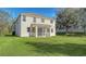 Large backyard with grassy area and two-story home at 6963 74Th Street E Cir, Bradenton, FL 34203