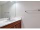 Small bathroom with wood vanity and mirror at 6963 74Th Street E Cir, Bradenton, FL 34203
