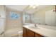 Clean bathroom with a shower/tub combo and wood vanity at 6963 74Th Street E Cir, Bradenton, FL 34203