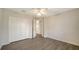 Bright bedroom with double door closet and wood-look floors at 6963 74Th Street E Cir, Bradenton, FL 34203