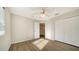 Bright bedroom with wood-look floors, ceiling fan, and ample closet space at 6963 74Th Street E Cir, Bradenton, FL 34203