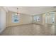 Spacious dining room with tiled floors and large windows at 6963 74Th Street E Cir, Bradenton, FL 34203
