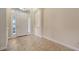 Bright entryway with tiled floors and a white front door at 6963 74Th Street E Cir, Bradenton, FL 34203