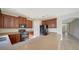 Kitchen with wooden cabinets, island, and breakfast bar at 6963 74Th Street E Cir, Bradenton, FL 34203