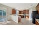 Kitchen with wooden cabinets and black appliances at 6963 74Th Street E Cir, Bradenton, FL 34203