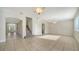 Spacious living room with tile floors and staircase at 6963 74Th Street E Cir, Bradenton, FL 34203
