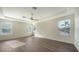 Main bedroom with hardwood floors and multiple windows at 6963 74Th Street E Cir, Bradenton, FL 34203