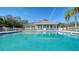 Sparkling community pool with adjacent clubhouse at 6963 74Th Street E Cir, Bradenton, FL 34203